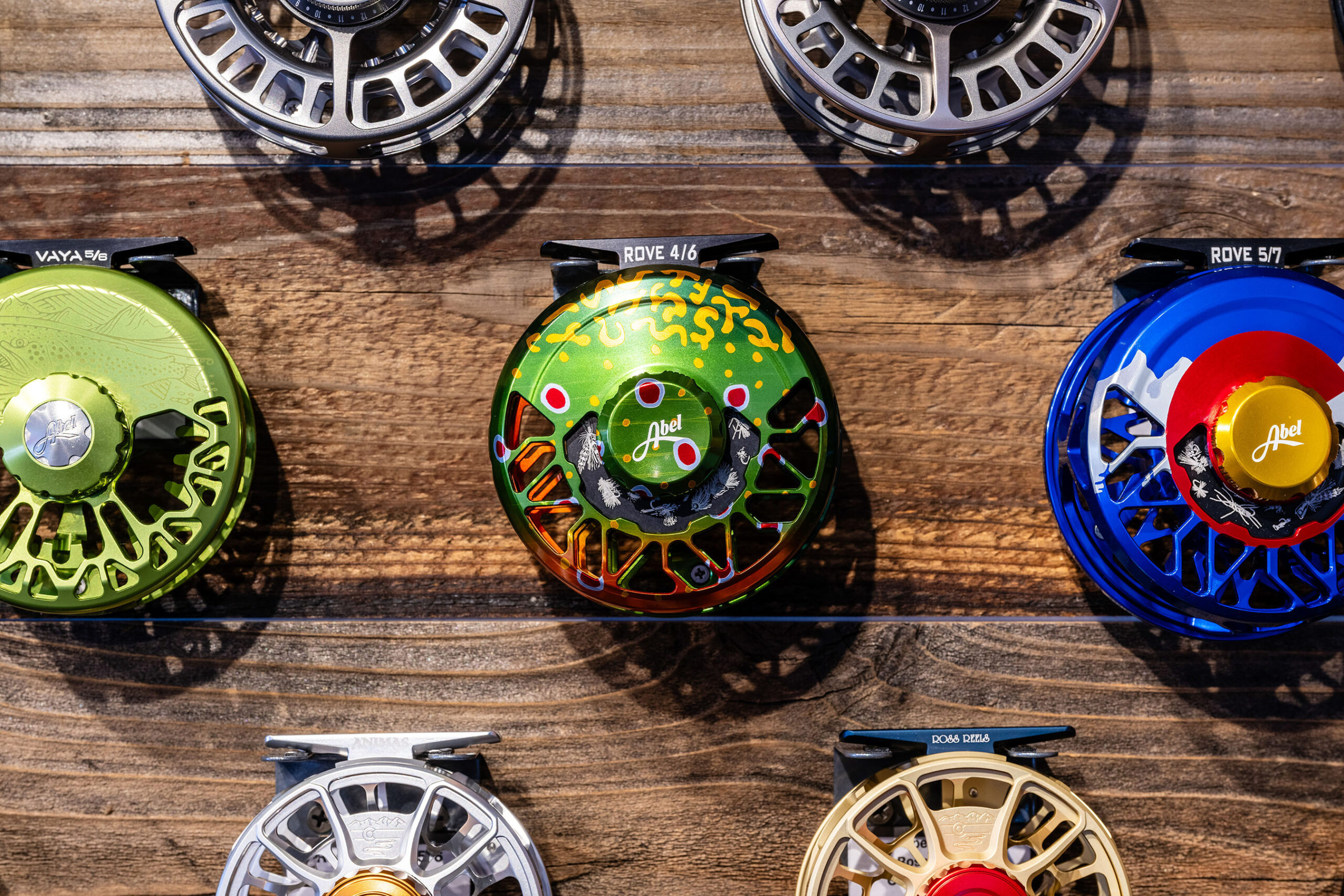 Fly fishing reels for sale on display.